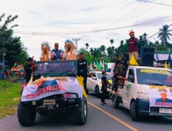 Pasangan Maxsi Ahoren dan Imam Syafi’i Diantar Ribuan Massa Pendukung Daftar Cakada Di KPU Mansel